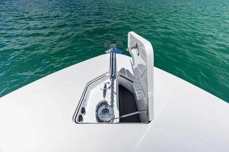 Slide: The Image of Bow of 2025 HCB 56 Suenos GIX yacht with anchor mechanism in turquoise water. - 54