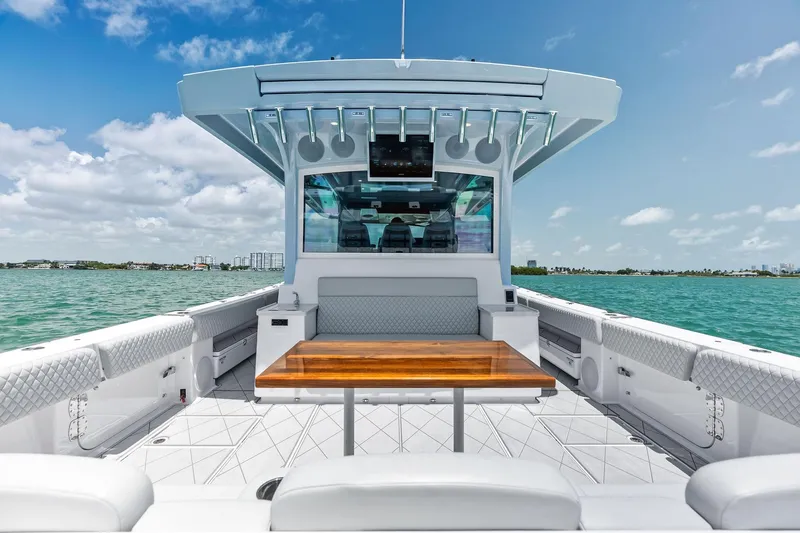 Slide: The Image of Luxury HCB 56 Suenos GIX boat interior with wooden table, ocean view, 2025 model. - 55