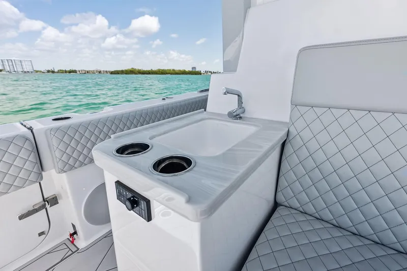 Slide: The Image of Luxury interior of 2025 HCB 56 Suenos GIX yacht with sink and quilted seating. - 60