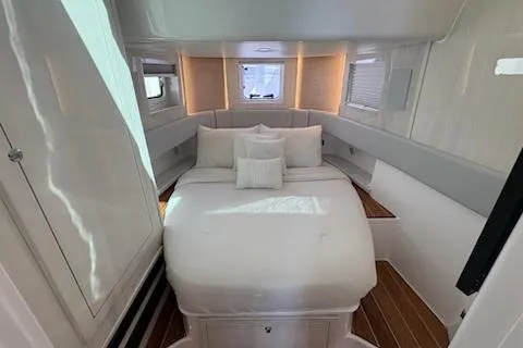 Slide: The Image of Luxurious cabin interior of 2025 HCB 56 Suenos GIX with elegant bedding and ambient lighting. - 62