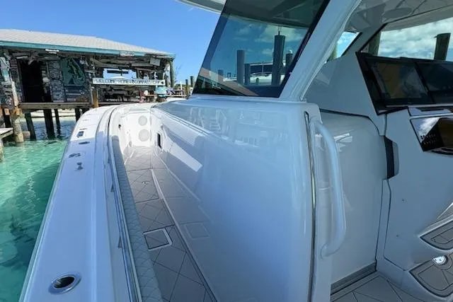 Slide: The Image of 2025 HCB 56 Suenos GIX luxury yacht docked, showcasing sleek design and modern features. - 67