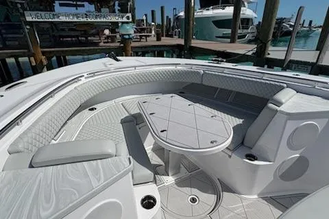 Slide: The Image of Luxurious seating area on 2025 HCB 56 Suenos GIX yacht, docked at marina. - 68