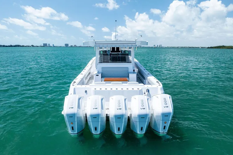 Slide: The Image of 2025 HCB 56 Suenos GIX boat with five V12 engines on turquoise water. - 8