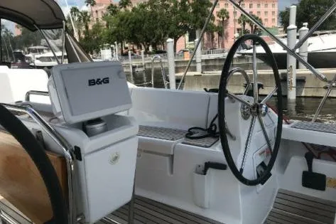 Slide: The Image of 2016 Jeanneau Sun Odyssey 419 sailboat cockpit with steering wheel and navigation equipment. - 4