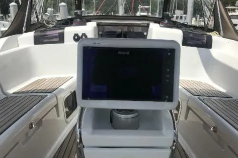Slide: The Image of 2016 Jeanneau Sun Odyssey 419 cockpit with navigation display and seating. - 5