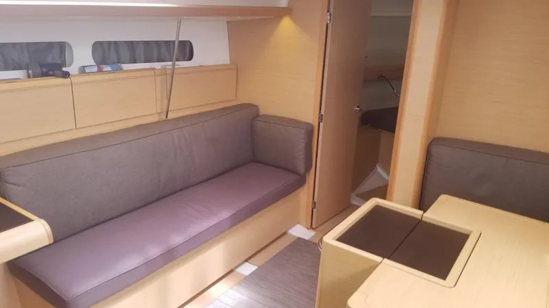 Slide: The Image of Interior of 2016 Jeanneau Sun Odyssey 419 yacht with cozy seating and modern design. - 6