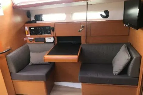 Slide: The Image of Interior of 2016 Jeanneau Sun Odyssey 419 sailboat with seating and navigation equipment. - 9