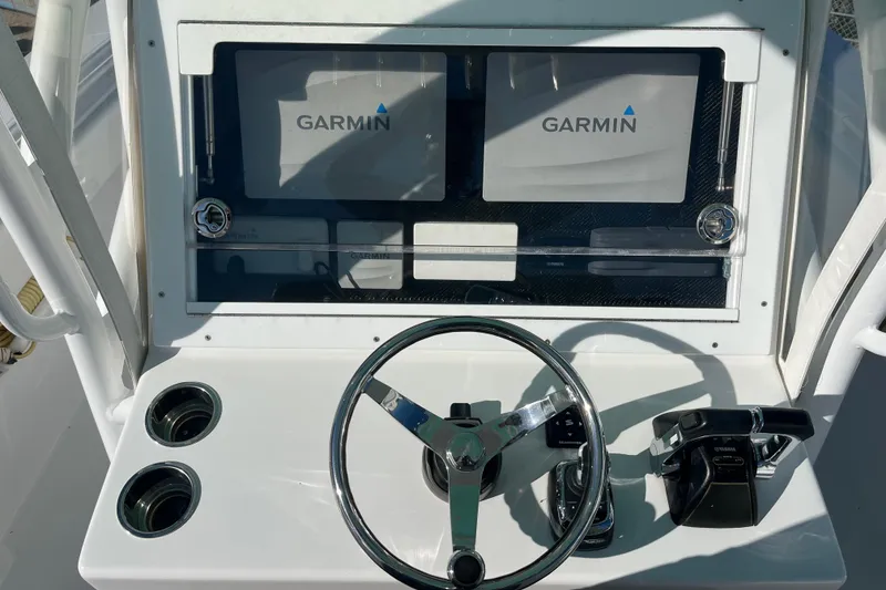 Slide: The Image of 2018 SeaHunter 31 Tournament dashboard with Garmin displays and steering wheel. - 5
