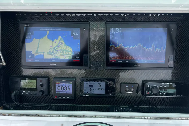 Slide: The Image of Control panel of 2018 SeaHunter 31 Tournament with Garmin navigation and Yamaha systems. - 6