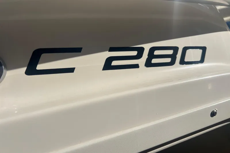 Slide: The Image of 2010 Pursuit C 280 Center Console boat model lettering. - 17