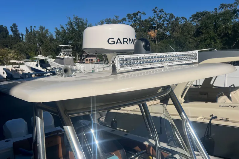 Slide: The Image of 2010 Pursuit C 280 Center Console with Garmin radar and LED light bar. - 18