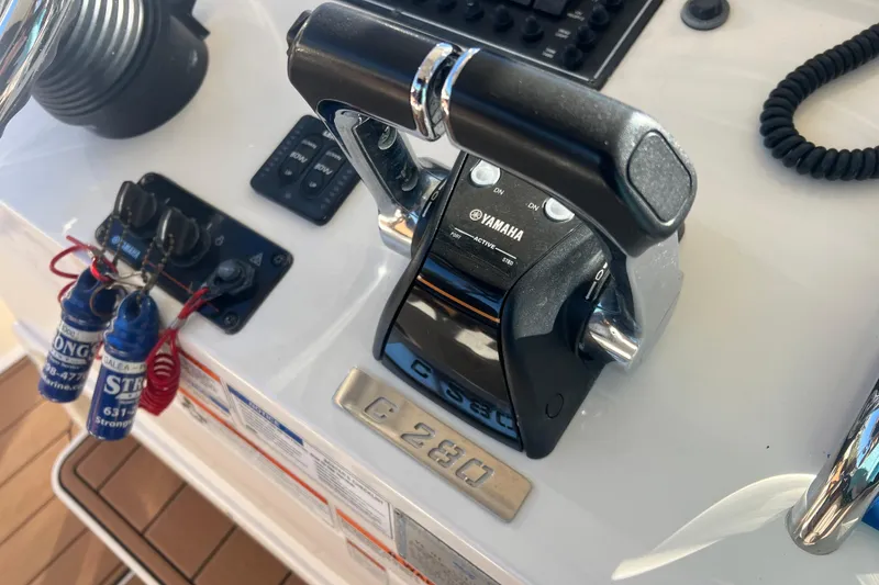 Slide: The Image of Close-up of 2010 Pursuit C 280 Center Console controls with Yamaha throttle. - 21