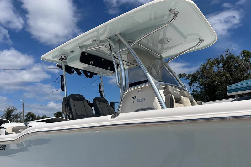 Slide: The Image of 2026 Key West 263 FS boat with T-top under blue sky. - 4