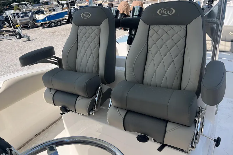 Slide: The Image of 2026 Key West 263 FS boat seats with diamond-stitched upholstery and armrests. - 8