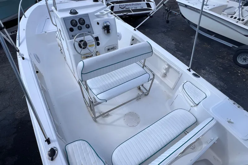 Slide: The Image of 2005 Sea Fox 197 Center Console boat interior with seating and control panel. - 15