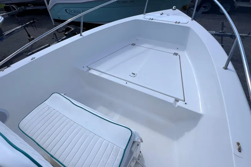 Slide: The Image of 2005 Sea Fox 197 Center Console boat interior with seating and storage. - 17