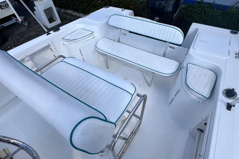 Slide: The Image of 2005 Sea Fox 197 Center Console boat interior with white cushioned seating. - 21
