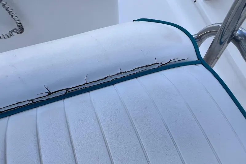 Slide: The Image of Cracked seat upholstery on 2005 Sea Fox 197 Center Console boat. - 23
