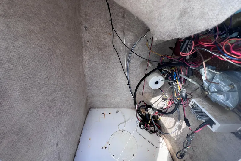Slide: The Image of Interior wiring of a 2005 Sea Fox 197 Center Console boat, showing cables and components. - 28