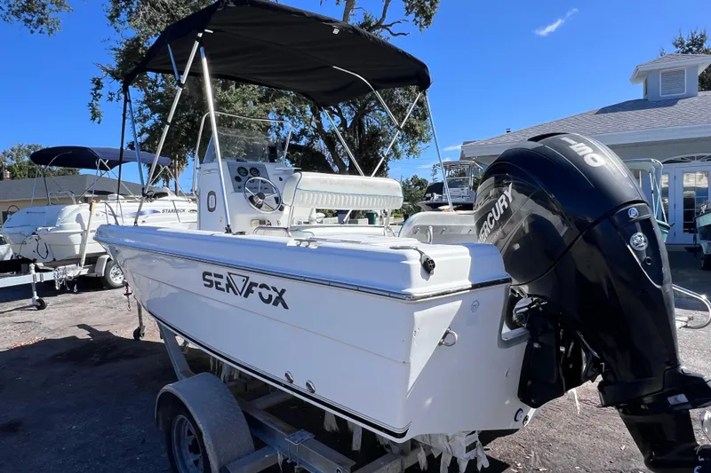 Slide: The Image of 2005 Sea Fox 197 Center Console boat with Mercury engine on trailer. - 3