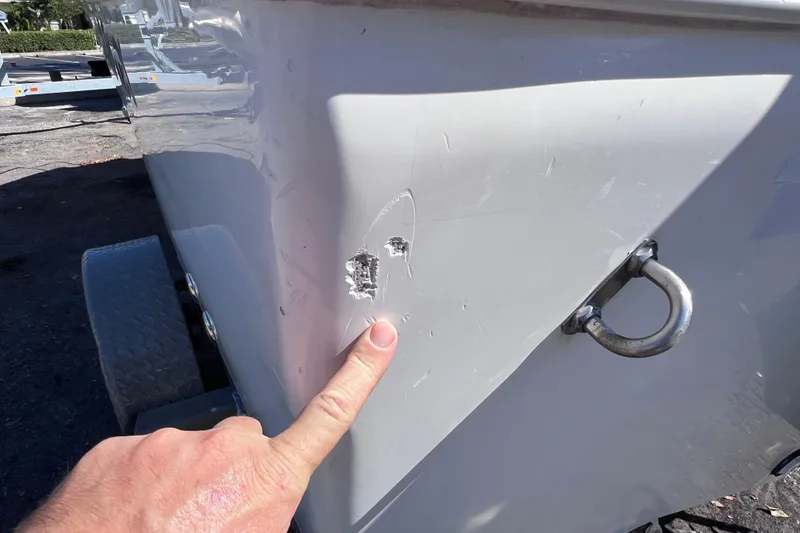 Slide: The Image of Close-up of damage on 2005 Sea Fox 197 Center Console boat hull. - 4