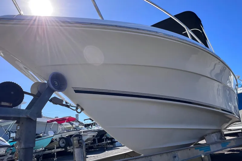 Slide: The Image of 2005 Sea Fox 197 Center Console boat on trailer under bright sunlight. - 7