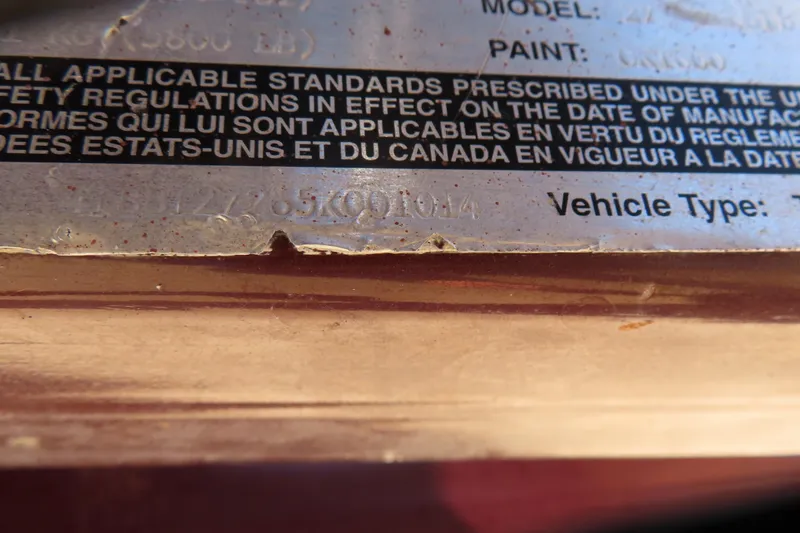 Slide: The Image of Close-up of a 2005 Cobalt 272 vehicle identification plate with text details. - 13
