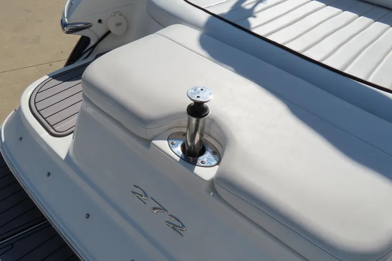 Slide: The Image of 2005 Cobalt 272 boat stern with white seating and stainless steel hardware. - 29