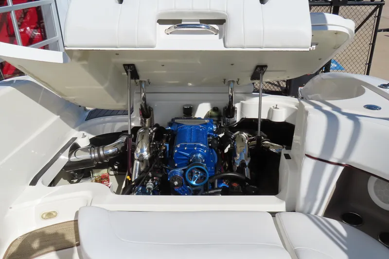 Slide: The Image of Open engine compartment of a 2005 Cobalt 272 boat, showcasing a blue engine. - 8