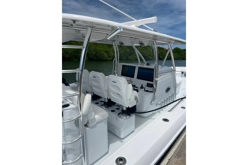 Slide: The Image of 2025 Contender 44 ST boat interior with modern seating and navigation equipment. - 5