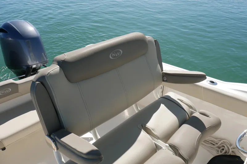 Slide: The Image of 2021 Key West 244 Center Console boat with dual engines and cushioned seating. - 14