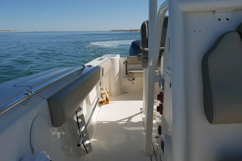 Slide: The Image of 2021 Key West 244 Center Console boat cruising on open water. - 19