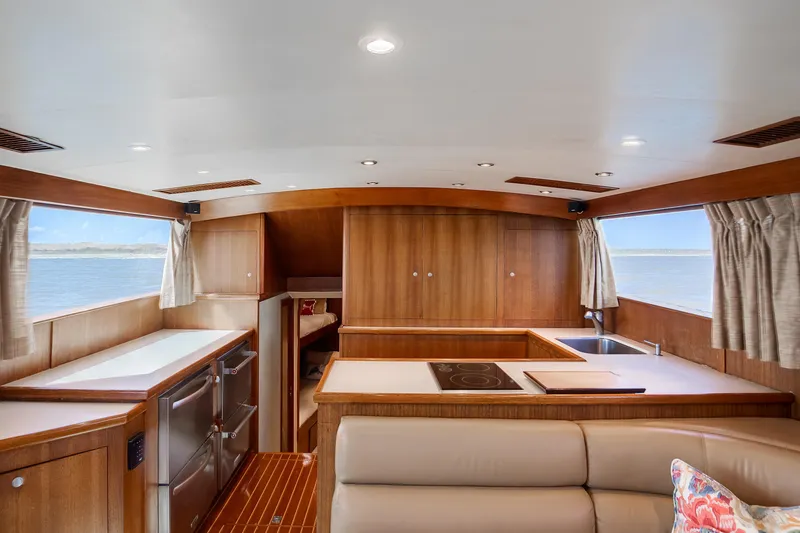 Slide: The Image of Luxurious 1972 Jim Smith Custom Convertible yacht interior with modern kitchen and ocean view. - 15