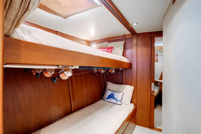 Slide: The Image of 1972 Jim Smith Custom Convertible interior with wooden bunk beds and fishing rods. - 17