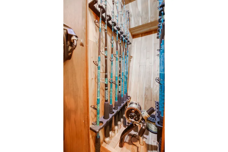 Slide: The Image of Fishing rods stored in a wooden compartment of a 1972 Jim Smith Custom Convertible. - 19
