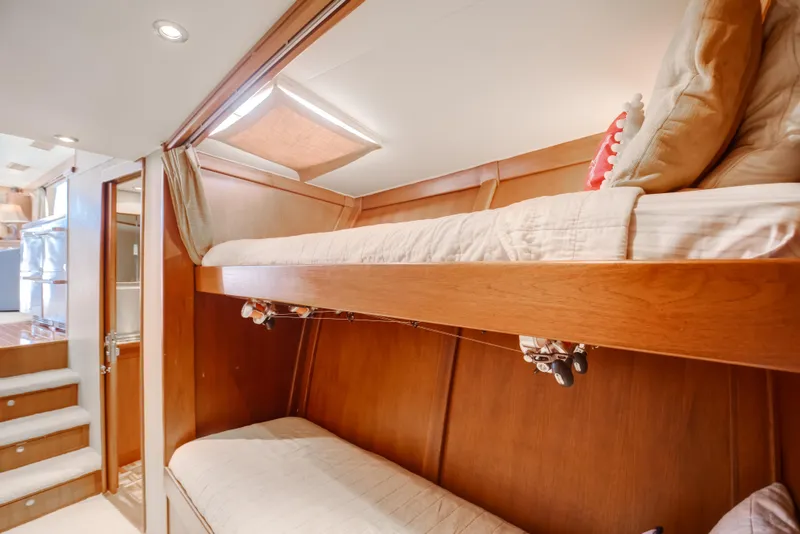 Slide: The Image of Interior of 1972 Jim Smith Custom Convertible with wooden bunk beds and cozy lighting. - 20