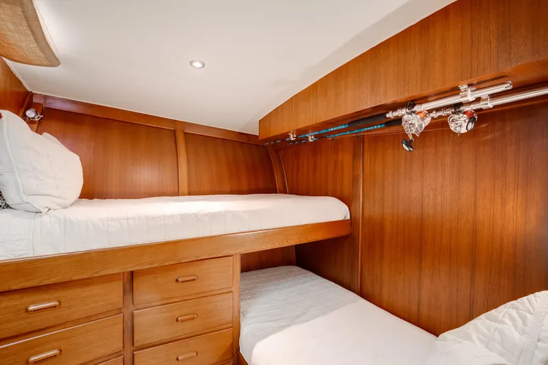 Slide: The Image of 1972 Jim Smith Custom Convertible interior with wooden bunk beds and fishing rods. - 22