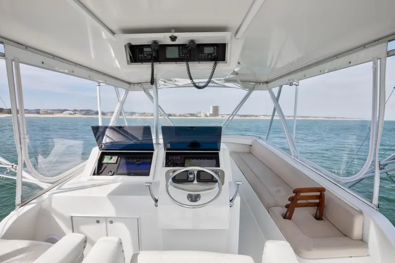 Slide: The Image of Interior of 1972 Jim Smith Custom Convertible boat with ocean view and navigation equipment. - 28