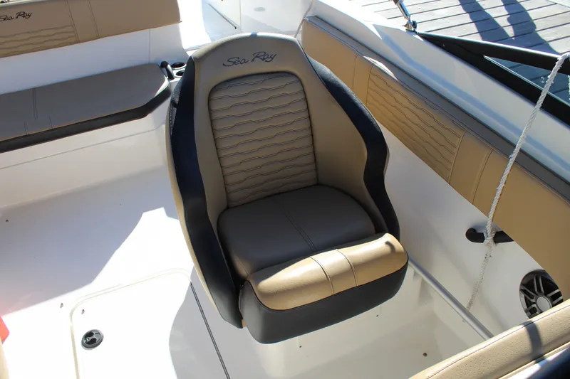 Slide: The Image of 2023 Sea Ray SPX 210 boat interior with tan and black seating. - 12