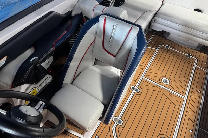 Slide: The Image of Interior of 2015 Nautique Super Air Nautique G23 with stylish seating and teak flooring. - 14