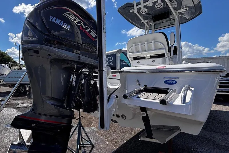 Slide: The Image of 2026 Tidewater 2300 Carolina Bay boat interior with open storage compartment and seating. - 12