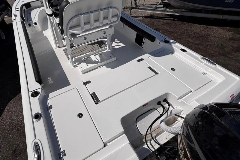 Slide: The Image of 2026 Tidewater 2300 Carolina Bay boat interior with seating and storage compartments. - 13