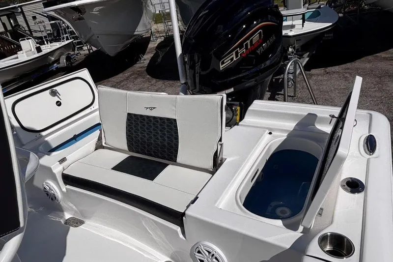 Slide: The Image of 2026 Tidewater 2300 Carolina Bay boat storage compartments with sliding trays. - 17