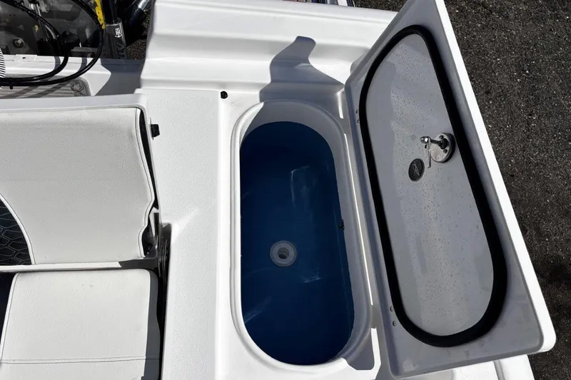 Slide: The Image of 2026 Tidewater 2300 Carolina Bay boat interior with steering console and seating. - 18