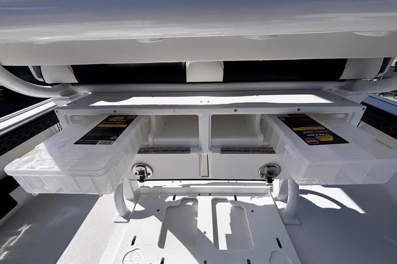 Slide: The Image of 2026 Tidewater 2300 Carolina Bay boat console with Garmin display and steering wheel. - 21