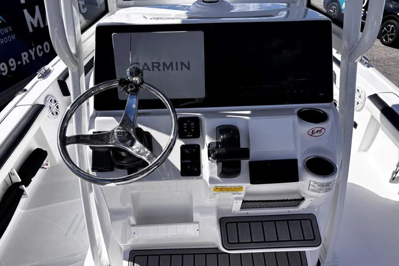 Slide: The Image of 2026 Tidewater 2300 Carolina Bay boat detail with TW logo and hinge mechanism. - 25