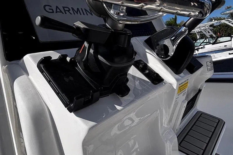 Slide: The Image of 2026 Tidewater 2300 Carolina Bay boat in a marina, showcasing sleek design and seating. - 31