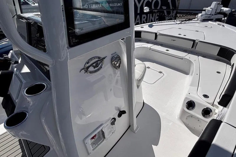 Slide: The Image of 2026 Tidewater 2300 Carolina Bay boat interior with open storage compartments and seating. - 33