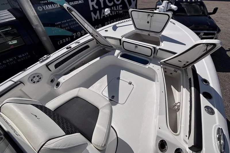 Slide: The Image of 2026 Tidewater 2300 Carolina Bay boat interior with open storage compartments. - 37