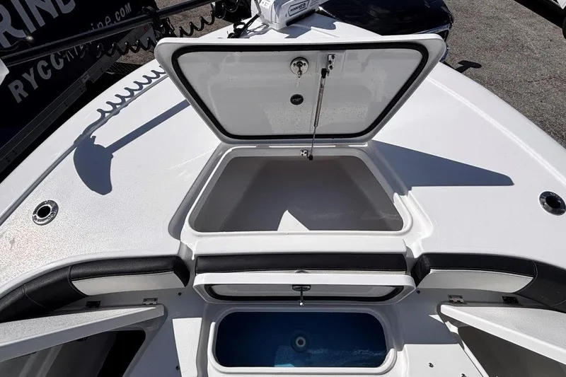 Slide: The Image of 2026 Tidewater 2300 Carolina Bay boat interior with seating and storage compartments. - 38
